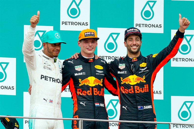 Verstappen on the podium with Hamilton (left) and Ricciardo (right) after winning the 2017 Malaysian Grand Prix
