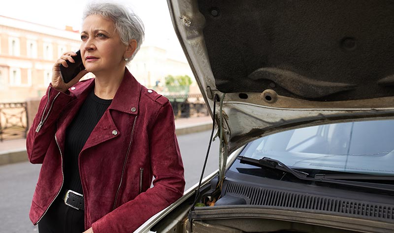 What To Know About The Virginia Lemon Law (2025) 1 woman calls for help next to broken down car